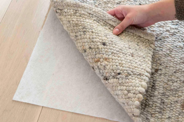 Wel of geen Top Stop anti-slip ondertapijt?